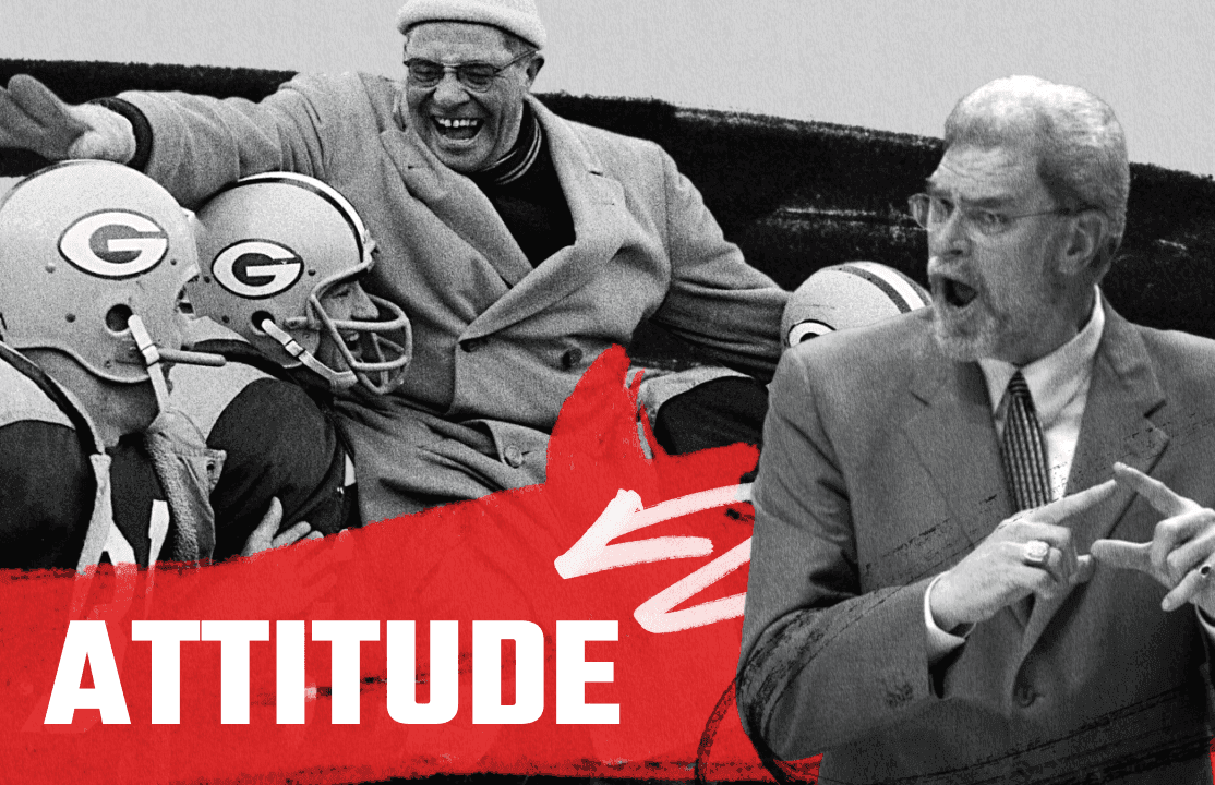 A coach speaks to a team on the sideline